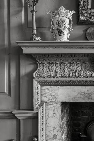 Detail of the parlor mantel and plaster paneling